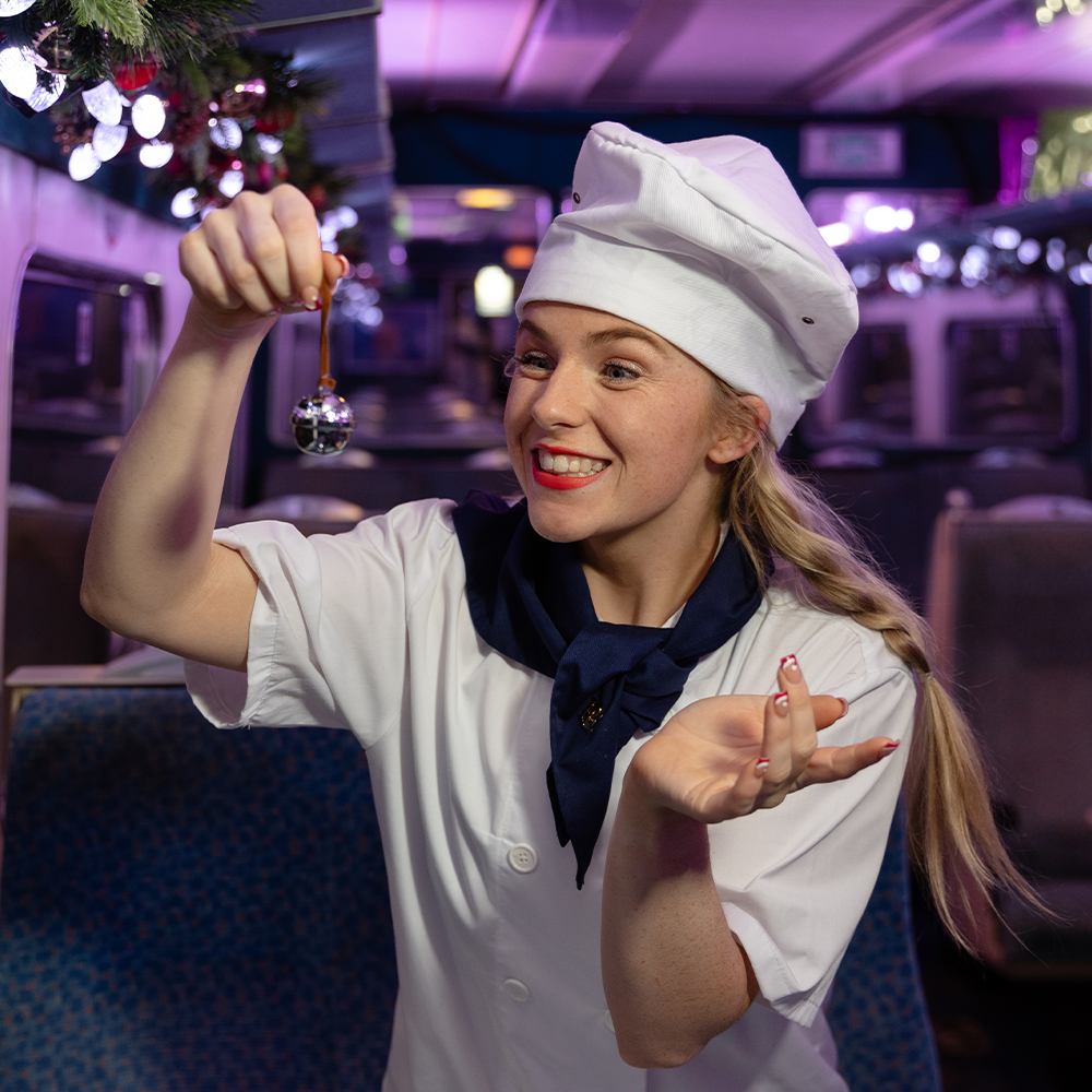 Chef with bell on board THE POLAR EXPRESS™ Train Ride 