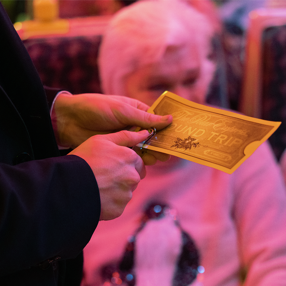 Conductor with ticket on board THE POLAR EXPRESS™ Train Ride 
